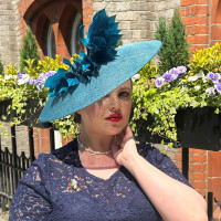 Lady in teal green feather hat